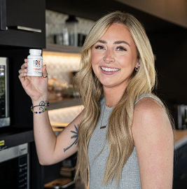 Smiling person holding a bottle of 10X Health Focus supplement, emphasizing user satisfaction.