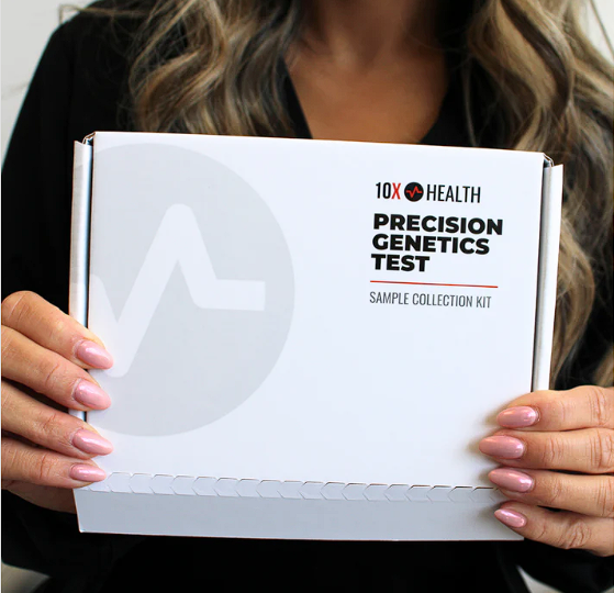 Person holding the 10X Health Precision Genetics sample collection kit.