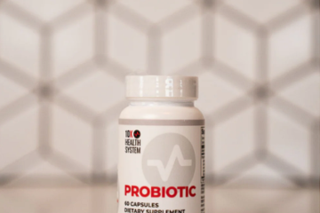 10X Health Probiotic bottle placed on a counter with a geometric background.