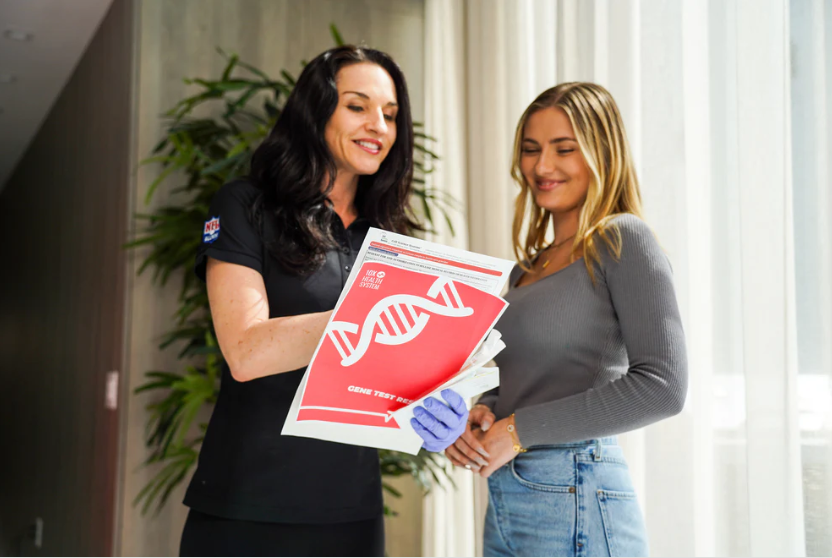 A woman holding her 10X Health Genetic Test results.