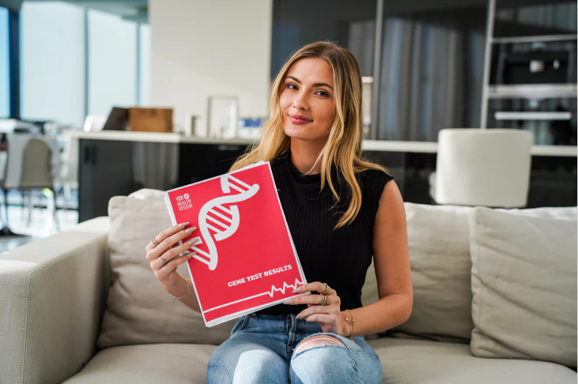  A health professional showing a woman her genetic test results.